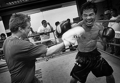 How many weight divisions has Manny Pacquiao won world championships in?