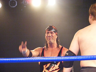 As of his last contract, how is Sean Waltman signed with WWE?