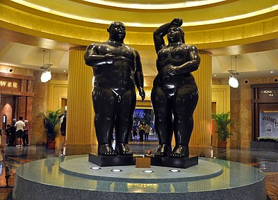 Botero's figures are often characterized by what feature?