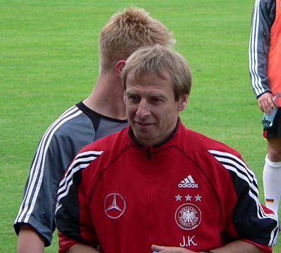 In which year did Jürgen Klinsmann retire from professional football?