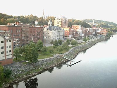 What is the name of the historic bridge that connects Augusta to neighboring Hallowell?