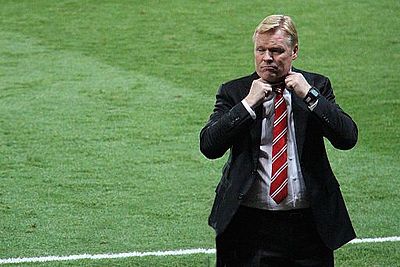 Which club did Koeman manage to an Eredivisie title in 2006-07?