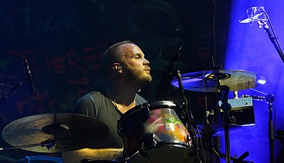 What type of drumming style is Will Champion known for?