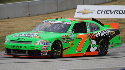 In which country did Danica Patrick move to further her racing career in 1998?