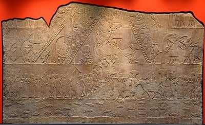 To what extremes did Ashurbanipal go against rebels?