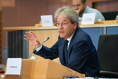 During his time as Prime Minister, Gentiloni passed a new electoral law and implemented what type of major reform?
