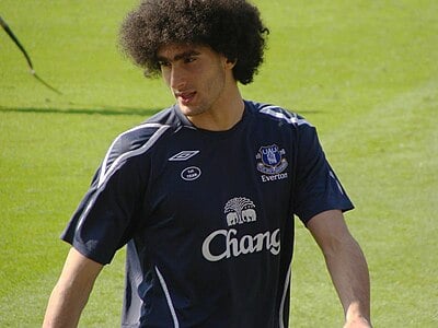 Which award did Fellaini win in the Belgian First Division?