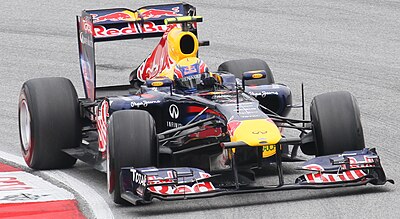 In which year did Mark Webber retire from professional racing?