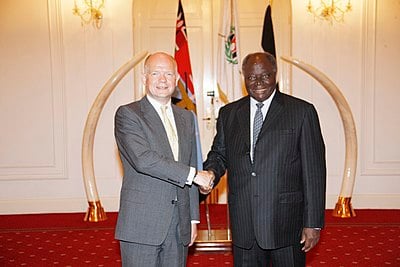 Kibaki was praised for stabilizing what aspect of Kenya's economy?