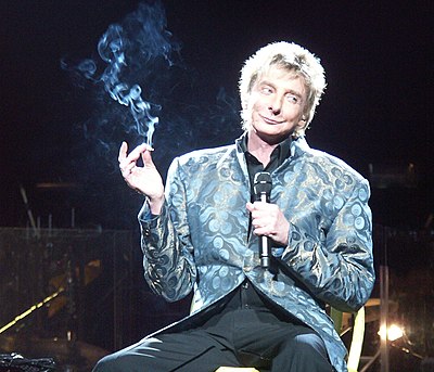 How many platinum albums has Manilow released?