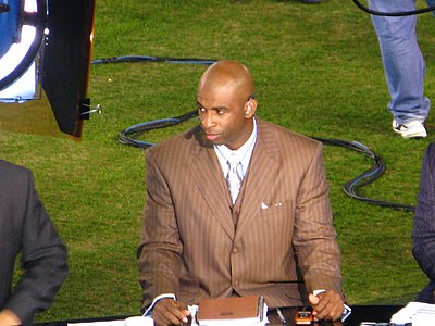 Which two sports did Deion Sanders play professionally?
