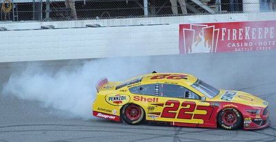 Prior to Penske, which was the last team for which Joey Logano raced?