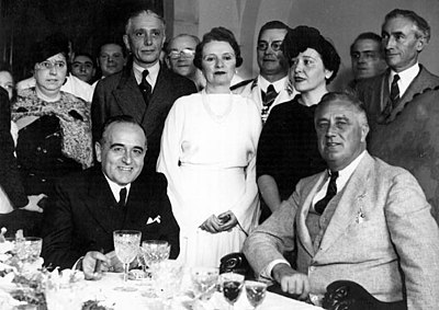 Who was Vargas sandwiched between leading Brazil into WWII?