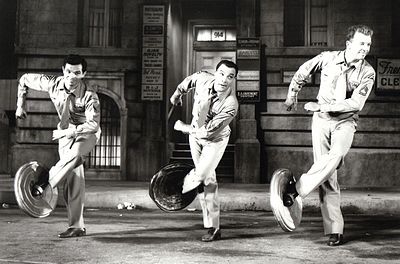 Gene Kelly was known for his energetic and what type of dancing style?