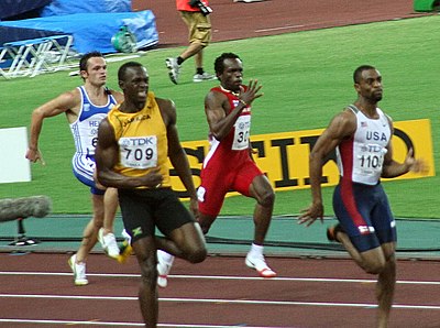 What was Tyson Gay's time in the 100m at the 2009 World Championships?