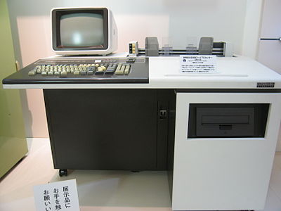 Which two companies merged to form Toshiba in 1939?
