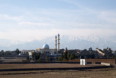 Which industry is prominent in Jalalabad due to its warm climate?