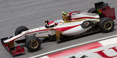 In what series was Karthikeyan racing from 2014 to 2018?