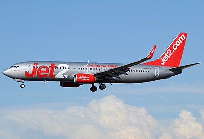 Which company did Jet2.com overtake to become the largest tour operator in the UK in 2023?