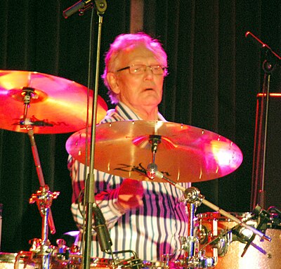 For which song did Ginger Baker perform a notable lengthy drum solo?