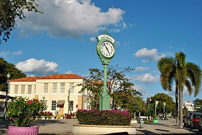 What is the name of the land development scheme that increased the population of Lake Worth Beach in 1912?