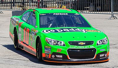 In which year did Danica Patrick become the first woman to win a pole position in the NASCAR Cup Series?