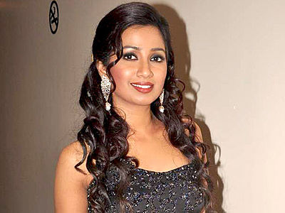 How many times has Shreya Ghoshal been featured in the Forbes list of the top 100 celebrities from India?