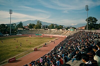 Which country did Nepal defeat to secure their first-ever international football victory?