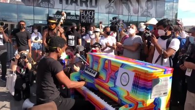 What instrument does Jon Batiste primarily play?