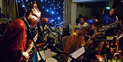 What kind of wardrobe did The Arkestra often don in their performances?