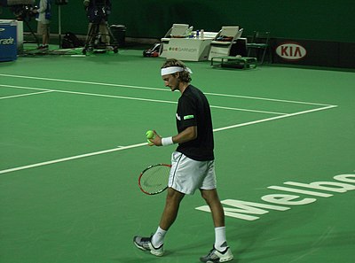 How many ATP titles did Juan Carlos Ferrero win in his career?