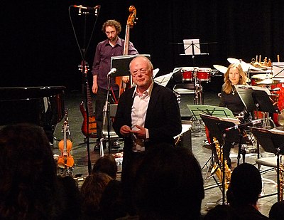 Andriessen's music is also compared to which famous Russian composer?