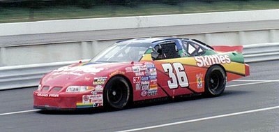 Apart from being a racing driver, what is another role Derrike Cope held within his racing team?