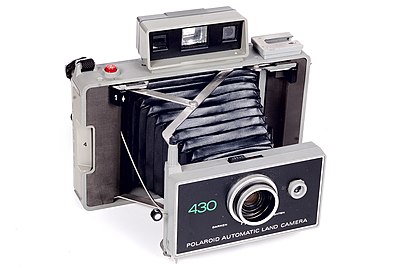 What did Edwin H. Land develop that led to the creation of the instant camera?