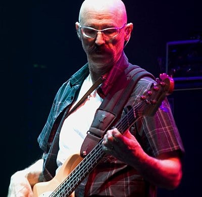 What is the full name of the American bassist known as "Tony Levin"?