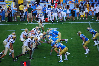 What conference does the UCLA Bruins football team currently belong to?