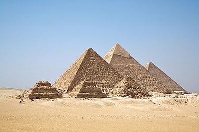 Where is Giza located in relation to the Nile River?