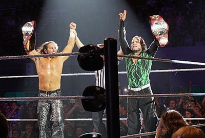 In which wrestling promotion did the Hardy Boyz win their first tag team championship?