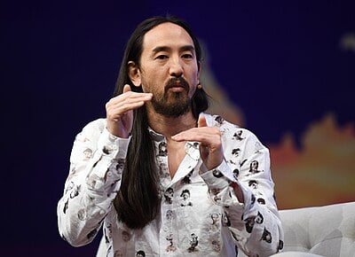 Who is featured with Steve Aoki in the song "Waste It on Me"?