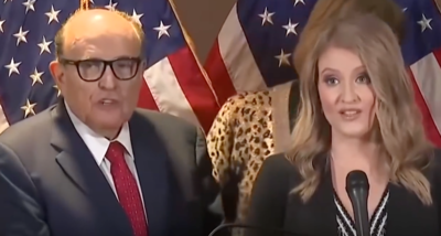 Which conspiracy theory did Rudy Giuliani promote regarding the 2018 and 2020 elections?