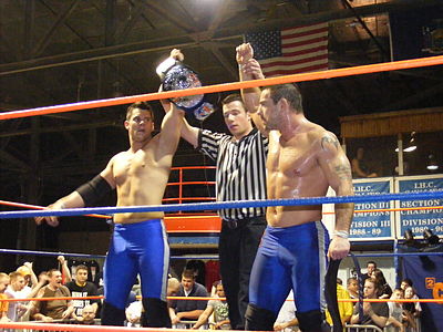 Who is Davey Richards's partner when he won the TNA World Tag Team Championship?