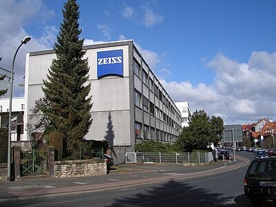 What type of manufacturer is Schott AG, which is also controlled by the Carl-Zeiss-Stiftung?