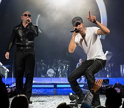 How many number-one songs does Enrique have on the Billboard Hot Latin Songs chart?