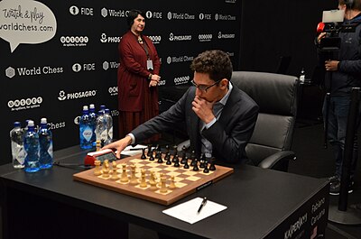 Which country did Caruana originally play for?