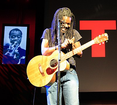 Tracy Chapman's music typically features which instrument prominently?