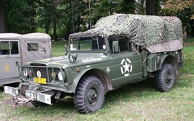 What is the name of the Jeep model that was designed as a military light utility vehicle and later inspired the Humvee?