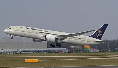 What is the primary language used on Saudia flights?