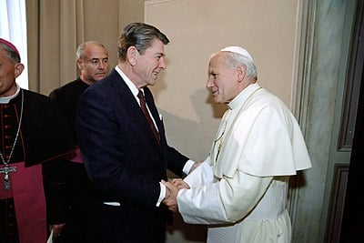 With what religion did Pope John Paul II strive to improve relations?
