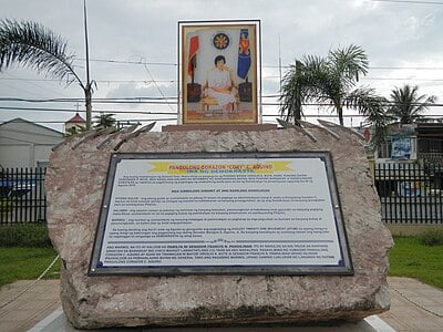 What is the location of Corazon Aquino's burial site?