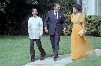 What is the religion or worldview of Imelda Marcos?